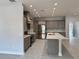 Spacious, modern kitchen with stainless steel appliances, custom cabinets, and a center island at 37533 Teri Ct, Dade City, FL 33525