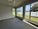 Covered lanai with screened windows overlooking the backyard at 37533 Teri Ct, Dade City, FL 33525