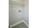Bright laundry hookups and overhead wire shelving at 37533 Teri Ct, Dade City, FL 33525