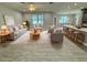 Open concept living room with tile floors and modern furniture at 37533 Teri Ct, Dade City, FL 33525