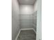 Walk-in pantry features wire shelving and durable tile flooring at 37533 Teri Ct, Dade City, FL 33525