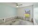 Bedroom with window is ready for new paint and flooring at 4025 Meadow Run Ln, Wesley Chapel, FL 33543