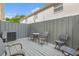 Cozy back patio with fenced-in area with seating for entertaining guests at 408 S Arrawana Ave # A4, Tampa, FL 33609
