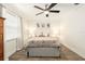 Cozy bedroom with a ceiling fan, botanical prints, and plenty of natural light at 408 S Arrawana Ave # A4, Tampa, FL 33609