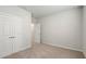 A minimal bedroom with carpeted floors and a closet at 4086 Polynesia Rd, North Port, FL 34288