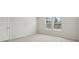 Bright and airy bedroom featuring a window, carpeted floors, and ample natural light at 4086 Polynesia Rd, North Port, FL 34288