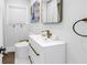 Modern bathroom featuring a sleek vanity, contemporary fixtures and a uniquely designed toilet at 420 S Matanzas Ave, Tampa, FL 33609