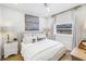 Serene bedroom with a comfortable bed, white linens, soft lighting, and neutral decor for a tranquil atmosphere at 420 S Matanzas Ave, Tampa, FL 33609