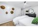 Inviting bedroom with modern decor, featuring a large bed, stylish dresser, and unique wall decor at 420 S Matanzas Ave, Tampa, FL 33609