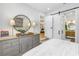 Bright bedroom showing neutral decor, ensuite bath and dining area, connected by sleek sliding barn doors at 420 S Matanzas Ave, Tampa, FL 33609