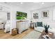 Cozy living room with light-colored wood floors and natural light, adjacent to a bedroom for easy access at 420 S Matanzas Ave, Tampa, FL 33609