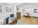 Well-lit living room with stylish decor and a dining area, complete with light-colored wood floors and white walls at 420 S Matanzas Ave, Tampa, FL 33609