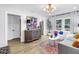 Bright living room showcasing a modern cabinet, stylish decor, and an open layout with wood flooring at 420 S Matanzas Ave, Tampa, FL 33609