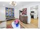 Open-concept living area with a modern cabinet, stylish decor, and view into the kitchen at 420 S Matanzas Ave, Tampa, FL 33609