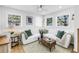 Cozy living room featuring a comfortable sectional sofa, an area rug, and plenty of natural light at 420 S Matanzas Ave, Tampa, FL 33609