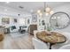 Bright and airy living space with modern decor, wood floors, and an open layout connecting to the dining area at 420 S Matanzas Ave, Tampa, FL 33609