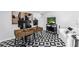 Home office featuring modern décor, multiple monitors, unique flooring and a comfortable seating area at 420 S Matanzas Ave, Tampa, FL 33609