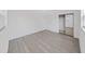 This well-lit bedroom features fresh paint, sleek floors, and a mirrored closet at 4426 4Th N Ave, St Petersburg, FL 33713