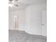 Neutral bedroom with carpet, white walls, a ceiling fan, and doorways into other rooms at 4810 Prime Ter, North Port, FL 34286