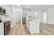 Stylish kitchen featuring stainless steel appliances, white cabinets, and an open layout at 4810 Prime Ter, North Port, FL 34286