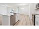 Open-concept kitchen featuring a large island, stainless steel dishwasher, and sleek fixtures at 4810 Prime Ter, North Port, FL 34286