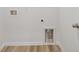 Laundry room featuring modern hook-ups and wood-style flooring at 4810 Prime Ter, North Port, FL 34286
