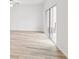 Bright living area with modern windows offering scenic views and wood-style floors at 4810 Prime Ter, North Port, FL 34286