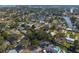 Aerial view of a neighborhood with many trees and water access at 4901 Venetian Ne Blvd, St Petersburg, FL 33703