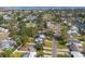 Aerial view of a neighborhood with many mature trees and houses at 4901 Venetian Ne Blvd, St Petersburg, FL 33703