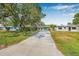 Charming single-story home with a long driveway, and well-maintained front yard at 4901 Venetian Ne Blvd, St Petersburg, FL 33703