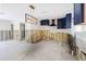 Open kitchen area features custom blue cabinets, modern lighting, and a stylish backsplash, ready for renovation at 4901 Venetian Ne Blvd, St Petersburg, FL 33703