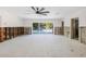 Spacious living room with sliding glass doors offering views of the backyard pool area at 4901 Venetian Ne Blvd, St Petersburg, FL 33703