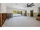 Spacious living room with sliding glass doors offering views of the backyard pool area at 4901 Venetian Ne Blvd, St Petersburg, FL 33703