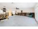 Expansive living room with modern lighting, large windows, and open layout, offering ample space for renovation at 4901 Venetian Ne Blvd, St Petersburg, FL 33703
