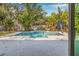 Backyard oasis featuring a luxurious pool, spa, and spacious patio area perfect for entertaining at 4901 Venetian Ne Blvd, St Petersburg, FL 33703