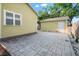 Backyard with a concrete patio and access to a detached garage and backyard at 5804 N 9Th St, Tampa, FL 33604