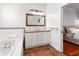 Bright bathroom with soaking tub, dual sinks, and neutral tile at 5804 N 9Th St, Tampa, FL 33604
