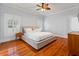 Primary bedroom featuring hardwood floors and neutral decor at 5804 N 9Th St, Tampa, FL 33604