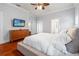 Primary bedroom with ensuite bath, walk-in closet, and hardwood floors at 5804 N 9Th St, Tampa, FL 33604