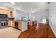 Open-concept kitchen featuring wooden cabinets, granite countertops, and stainless steel appliances at 5804 N 9Th St, Tampa, FL 33604