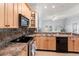Stylish kitchen featuring wooden cabinets, stainless steel appliances, and natural light at 5804 N 9Th St, Tampa, FL 33604