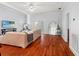 Bright living room with hardwood floors, neutral walls, and french doors to the outside at 5804 N 9Th St, Tampa, FL 33604