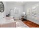 Bright home office featuring hardwood floors, neutral tones, and ample natural light at 5804 N 9Th St, Tampa, FL 33604
