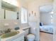 Bathroom featuring a green sink and a view into an adjacent bedroom at 6251 Danbury St, Spring Hill, FL 34606