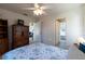 Bedroom featuring ceiling fan, TV on cabinet, and access to other rooms at 6251 Danbury St, Spring Hill, FL 34606