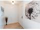 Inviting foyer with neutral carpet, a wall decoration and a white interior door at 6251 Danbury St, Spring Hill, FL 34606