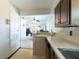Bright kitchen view to living room with breakfast bar and appliances at 6251 Danbury St, Spring Hill, FL 34606
