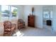 Bright living room featuring neutral carpet, a large window with natural light, and comfortable seating at 6251 Danbury St, Spring Hill, FL 34606