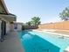 Sparkling pool with ladder and neutral patio, perfect for backyard enjoyment and recreation at 6251 Danbury St, Spring Hill, FL 34606