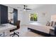 Bright bedroom with modern décor, featuring a mirrored closet and desk area at 7108 Pelican Island Dr, Tampa, FL 33634